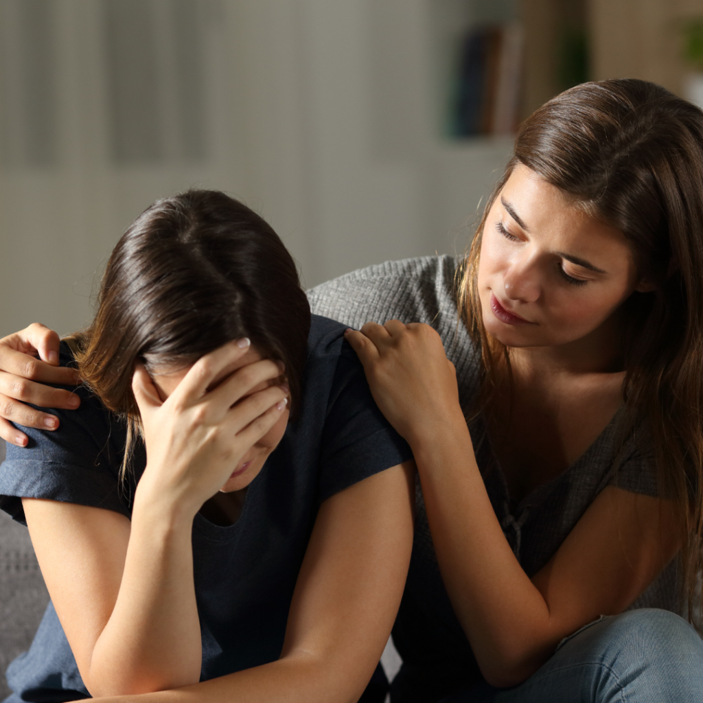 What is Discouragement? The image is of one woman encouraging another from being discouraged.