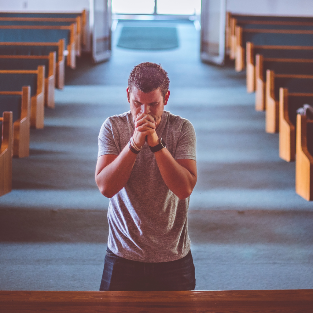 Going to church might cost you something. Choosing Jesus is not always easy. The image is of a man on his knees praying inside of a church.