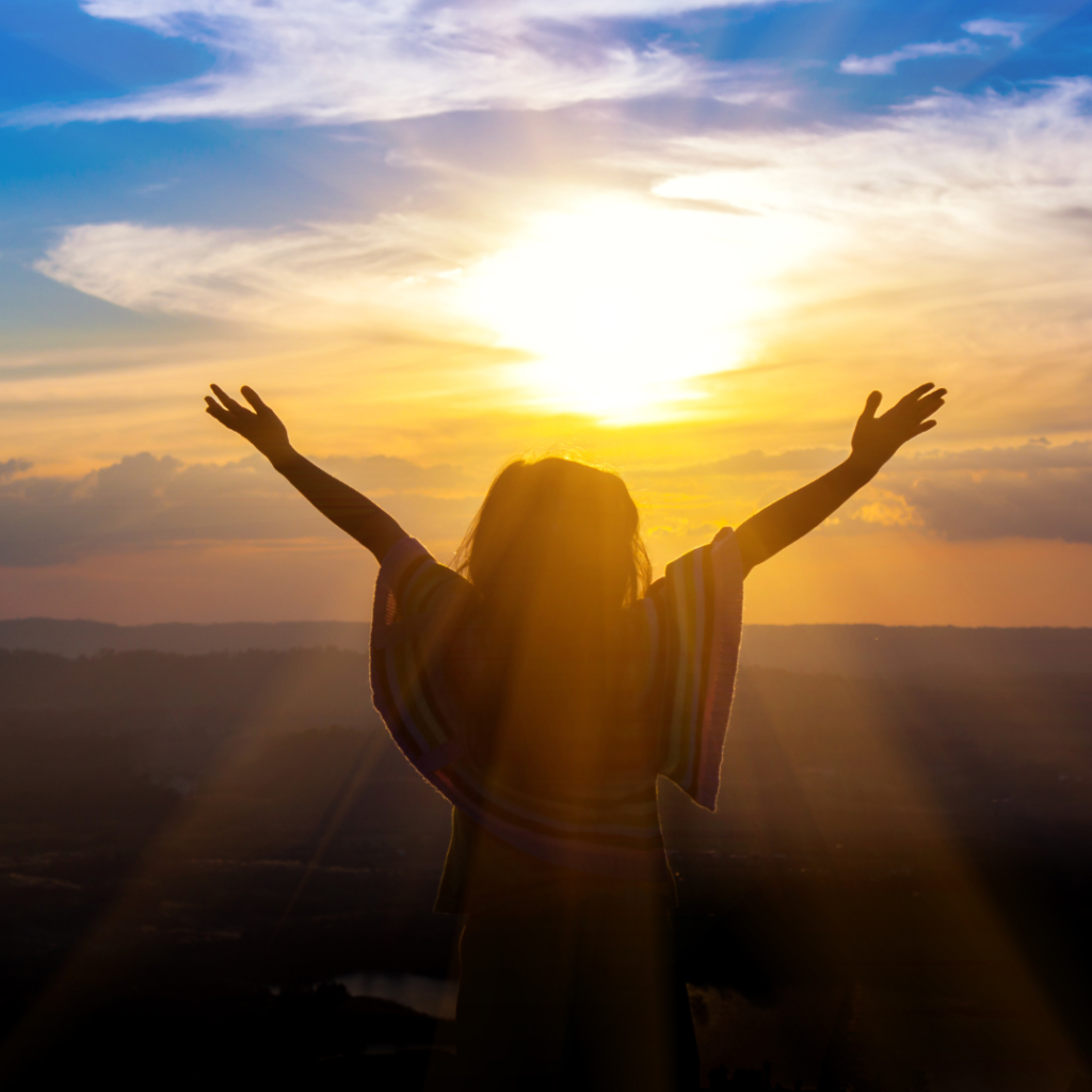 God's grace is always available to us even when we do wrong. The image is of a woman lifting hands wide open to the sky.